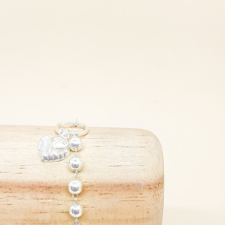 Pulseira malha bolinha e cartier com pingente de coração e ponto de luz em prata leve